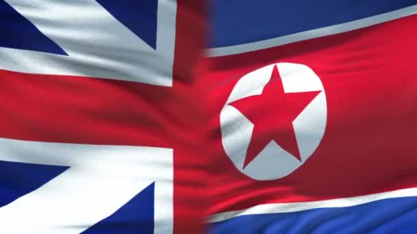 Gran Bretaña y Corea del Norte apretón de manos bandera de amistad internacional fondo — Vídeos de Stock