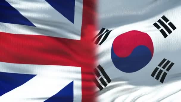 Великобритания и Южная Корея пожали друг другу руку на фоне международного флага дружбы — стоковое видео