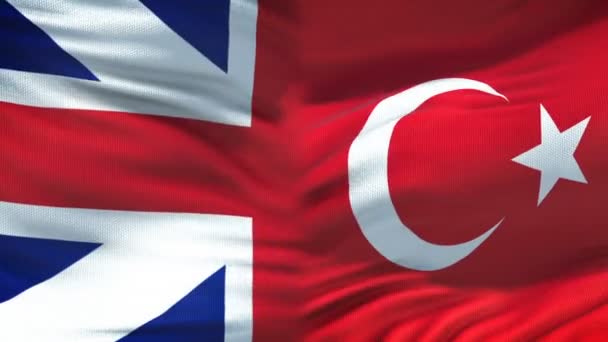İngiltere ve Türkiye'de el sıkışma, Uluslararası dostluk, arka plan bayrak — Stok video
