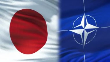 Brussels, Belçika - Haziran 2018 yaklaşık: Japonya ve Nato el sıkışma, Uluslararası dostluk ilişkileri, bayrak arka plan