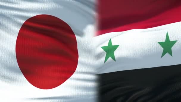 Japan en Syrië handdruk, internationale vriendschap relaties, vlag achtergrond — Stockvideo
