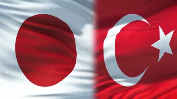 Japon et Turquie poignée de main, relations amicales internationales, fond drapeau — Video