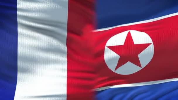 Frankrijk en Noord-Korea handdruk, internationale vriendschap, vlag achtergrond — Stockvideo