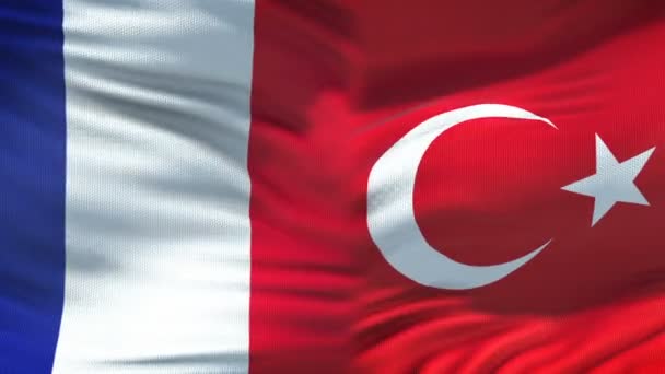France and Turkey handshake, international friendship relations, flag background — Stock Video