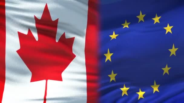 Canada en de Europese Unie handdruk, internationale vriendschap, vlag achtergrond — Stockvideo