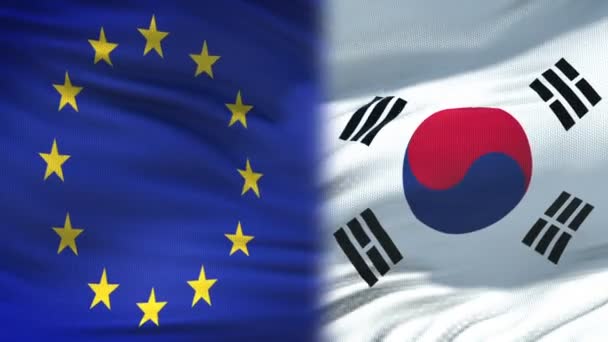 EU and South Korea handshake, international friendship relations flag background — Stock Video
