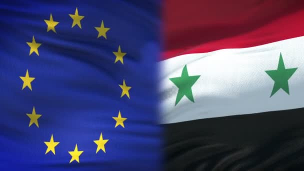 Europese Unie en Syrië handdruk, internationale vriendschap, vlag achtergrond — Stockvideo