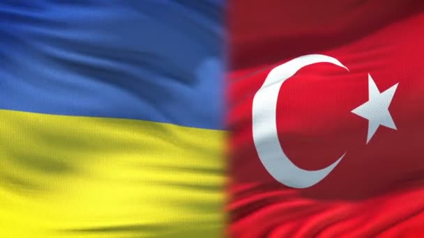 Ukraine and Turkey handshake, international friendship relations flag background — Stock Video