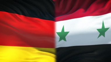 Almanya vs Suriye çatışma, uluslararası ilişkiler, yumruk bayrak arka plan üzerinde