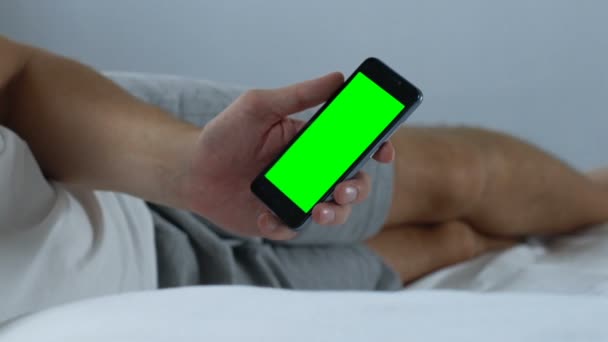 Man Scrolling Smartphone Application Lying Bed Green Screen Online Order — Stock Video