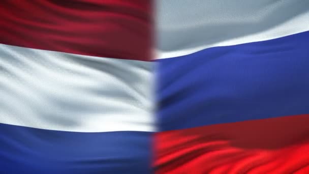 荷兰和俄罗斯握手 国际友谊 旗帜背景 — 图库视频影像