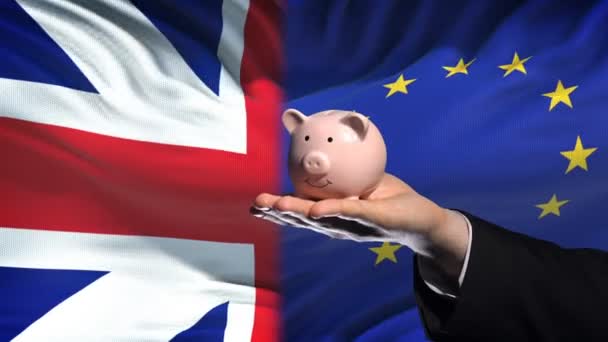 Great Britain Investment Hand Putting Money Piggybank Flag Background — Stock Video