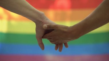 Hakları eşitlik gurur eşcinsel okşayarak ortak el lgbt bayrak arka plan, Mart