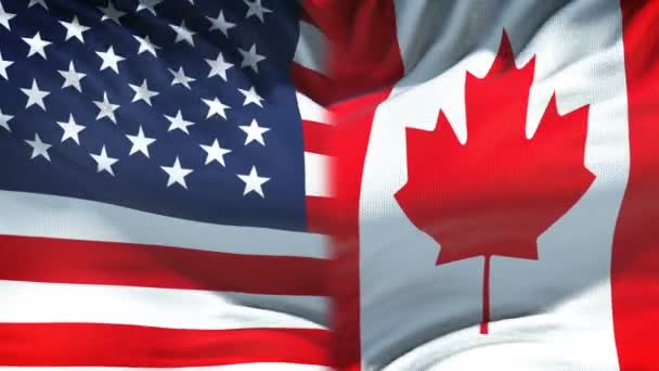 旗の背景に米国対カナダの対立 国の意見の相違 拳します — ストック動画