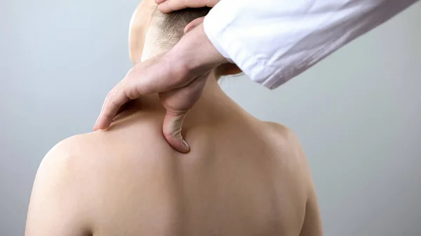 Neurologist examining female neck, examining head and shoulder, healthcare — Stock Image Neurologist Examining Female Neck Examining Head Shoulder Healthcare Royalty Free Stock Photos