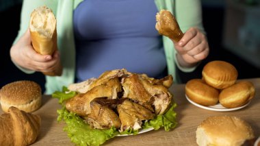 Curvy female preparing to eat chicken and bread, overeating problem, depression clipart