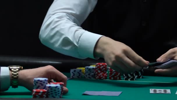 Male Casino Worker Dealing Cards Player Checking His Hand Luck — Stock Video