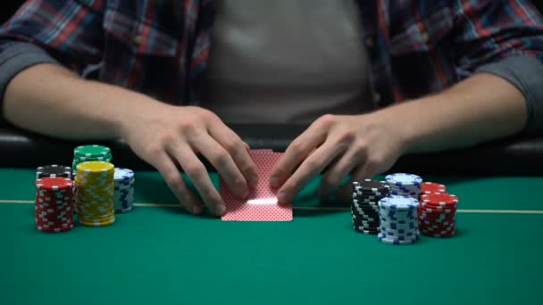 Poker Player Checking His Cards Raising Putting Dollars Table All — Stock Video