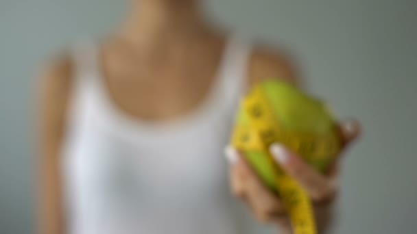 Girl Holding Apple Wrapped Measuring Tape Calculation Calories Diet — Stock Video