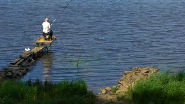 Senior Man Fishing Lake Pier Enjoying Relaxing Leisure Summer Recreation — Stock Video