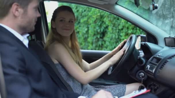 Smiling Woman Passed Driving License Exam Satisfied Instructor Writing Document — Stock Video