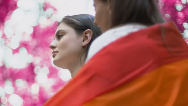 Female Wrapping Rainbow Flag Tenderly Kissing Same Sex Partner Park — Stock Video