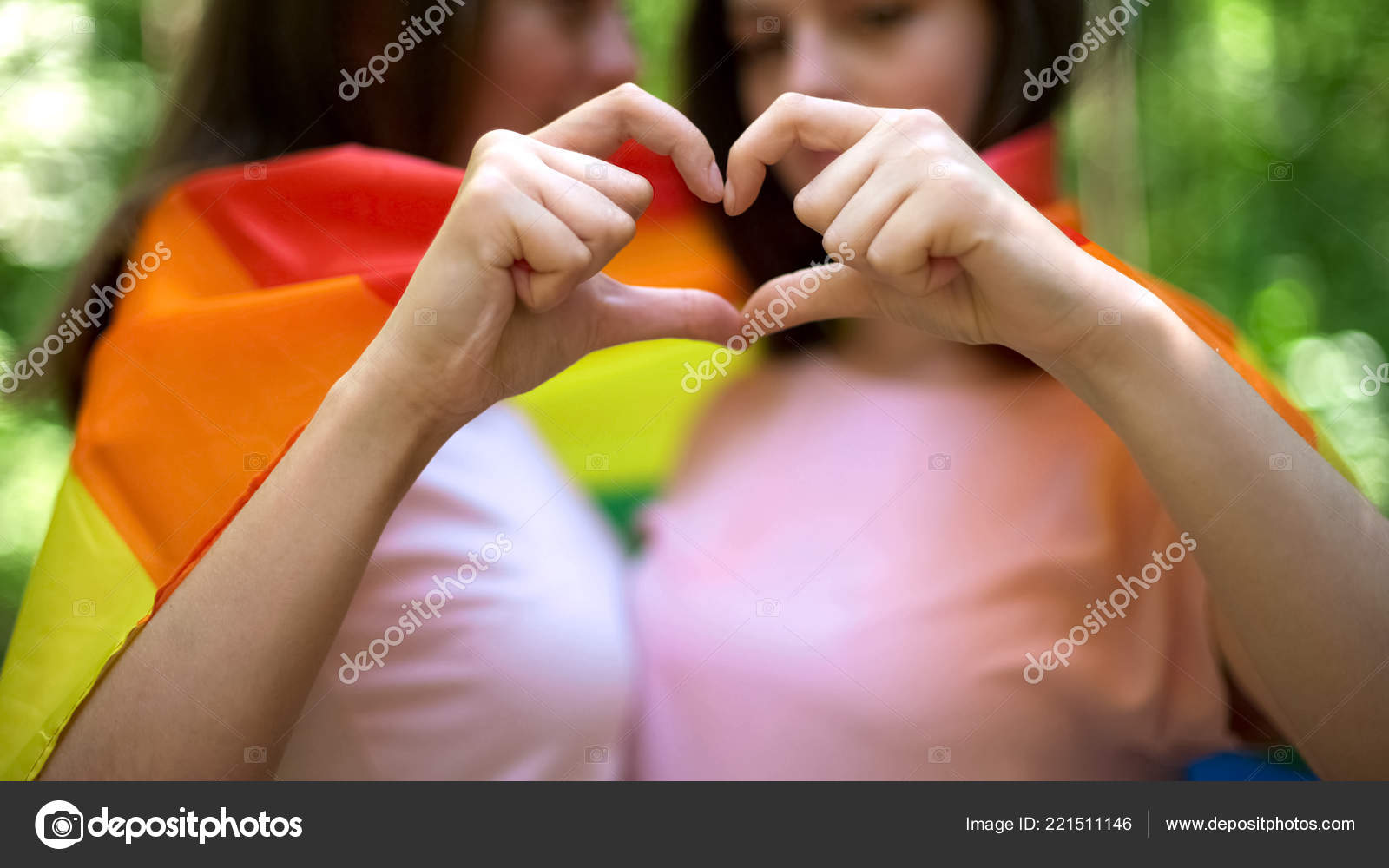 depositphotos_221511146-stock-photo-lesbian-couple-wrapped-rainbow-flag.jpg