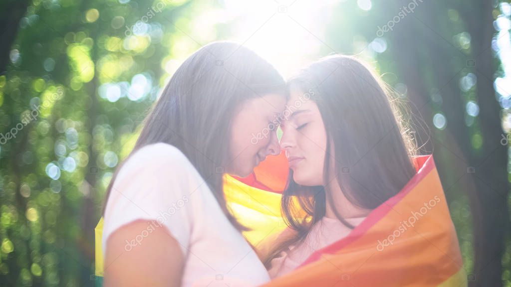 Two lesbians lit by sunlight, march of equality, legalizing same-sex relations