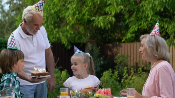 Birthday Girl Blowing Out Candles Making Wish Happy Childhood Grandparents — Stock Video