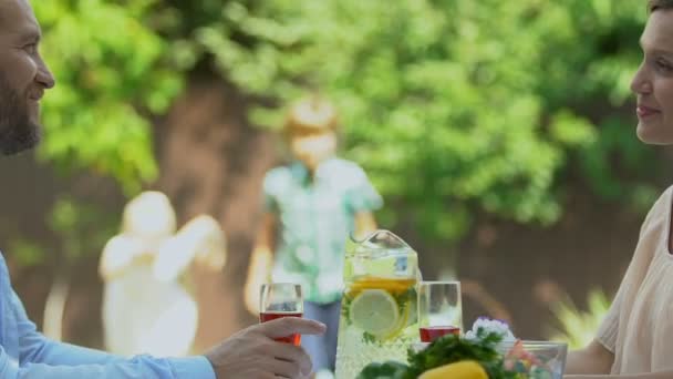 Family Having Dinner Outdoors Happy Children Running Parents Hugging Them — Stock Video