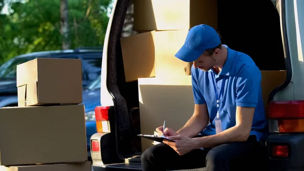 Delivery Man Filling Transportation Documents Sitting Van Trunk Duties — Stock Photo, Image