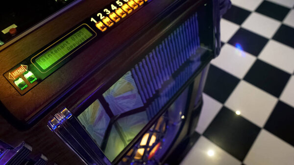 Antique music playing device in retro style cafe, vintage jukebox, old fashion