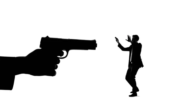 Silhouette Hand Gun Threatening Minuscule Man Life Danger Death Risk — Stock Photo, Image