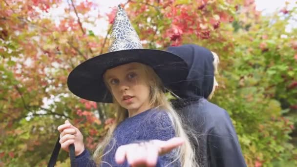 Little Witch Showing Toy Spider Camera Arachnophobia Fear Halloween — Stock Video
