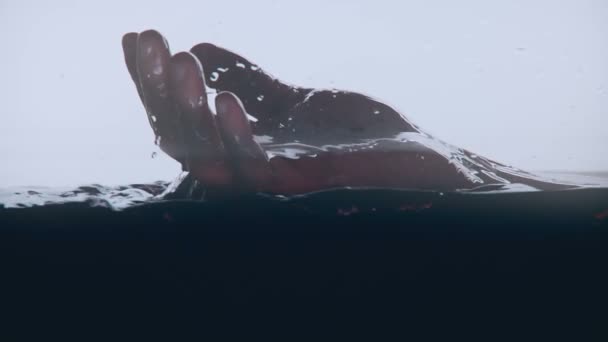 Dead or unconscious persons hand on water surface, depression and suicide — Stock Footage Dead Unconscious Persons Hand Water Surface Depression Suicide Stock Footage