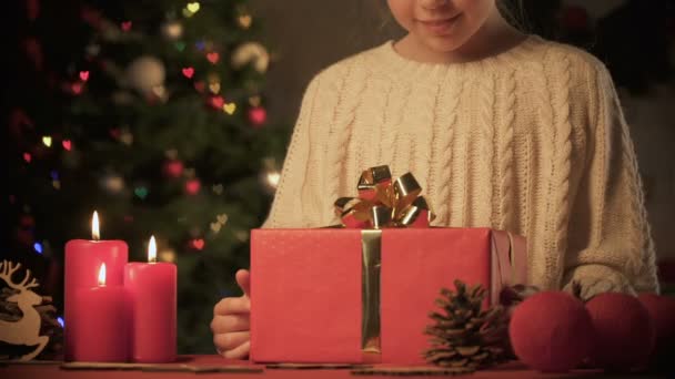 Cheerful Girl Placing Christmas Present Sparkling Tree Preparing Surprise — Stock Video