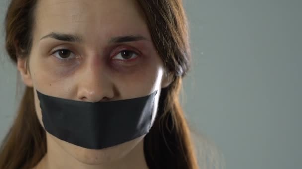 Sad Woman Taped Mouth Showing Tied Hands Helpless Kidnapping Victim — Stock Video