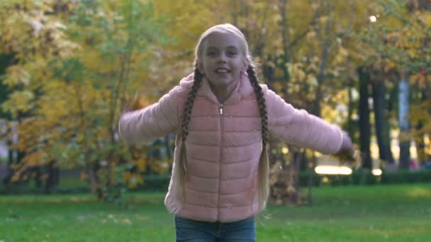 Happy Child Pigtails Throwing Autumn Leaves Joyful Childhood Time — Stock Video
