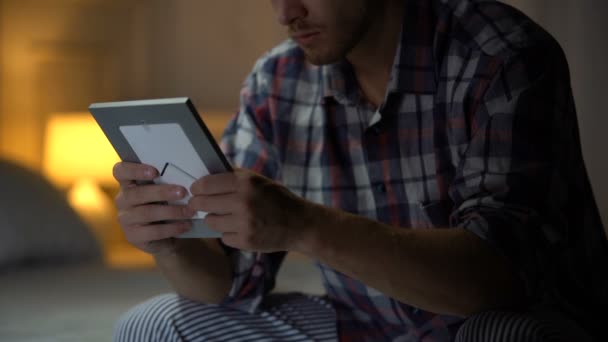 Lonely Man Sitting Bed Holding Photo Rubbing Hair Despair Depression — Stock Video