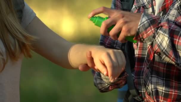 Caring Boyfriend Spraying Mosquito Repellent Girlfriend Hand Forest — Stock Video