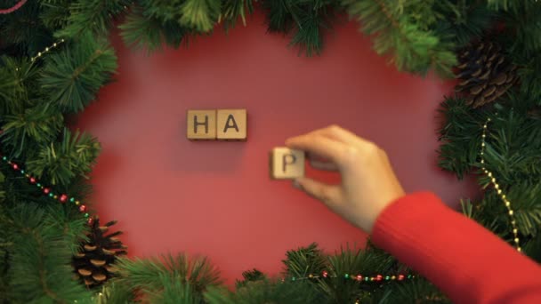 Happy New Year Female Hand Making Phrase Cubes Decorated Background — Stock Video