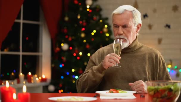 Lonely Male Sitting Sparkling Xmas Tree Having Champagne Christmas Eve — Stock Video