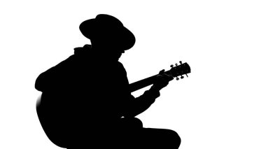 Gitar çalmak parti, serin hobi, eğlence şapkalı genç erkek silüeti