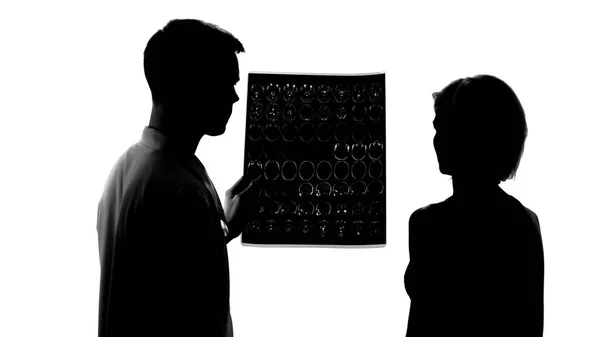 Silhouettes Young Doctor Showing Bad Mri Results Female Patient Treatment — Stock Photo, Image