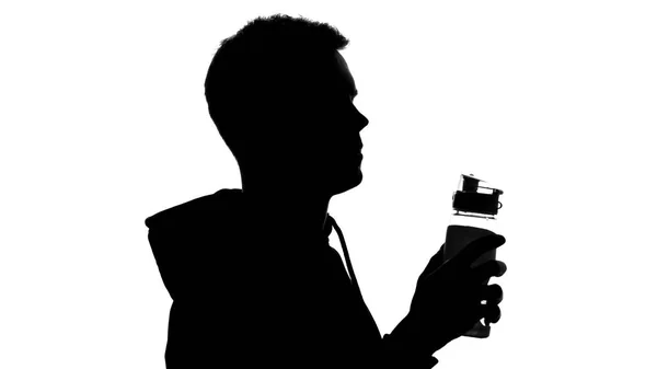 水をボトル トレーニング アクア バランス 水分補給後に保持している男性のシルエット — ストック写真