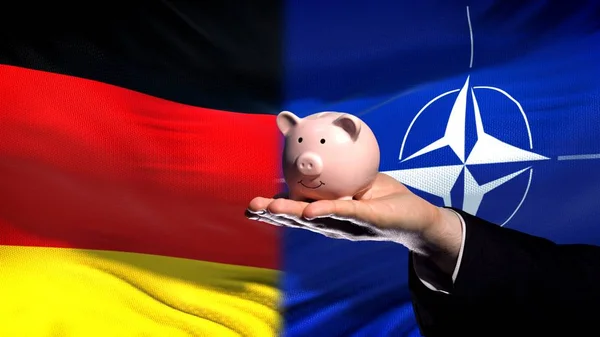 Tyskland Investeringar Nato Affärsman Hand Innehav Piggybank Flagga Bakgrund — Stockfoto