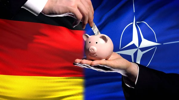 Tyskland Investeringar Nato Hand Att Lägga Pengar Piggybank Flagga Bakgrund — Stockfoto