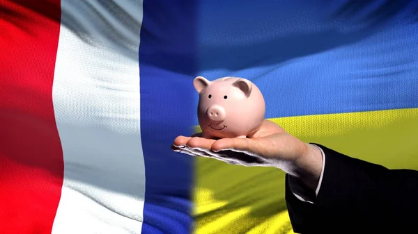 Frankreich Investitionen Der Ukraine Hand Hält Sparschwein Auf Flaggenhintergrund — Stockfoto