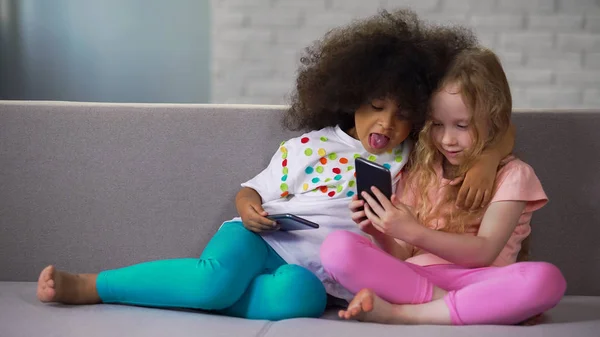 Adorable African American Girl Putting Out Her Tongue Playing Friend — Stock Photo, Image