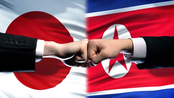 Japão Coreia Norte Conflito Relações Internacionais Punhos Fundo Bandeira — Fotografia de Stock
